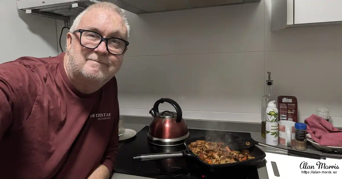 Alan Morris cooking sweet chilli chicken tortillas in his apartment.